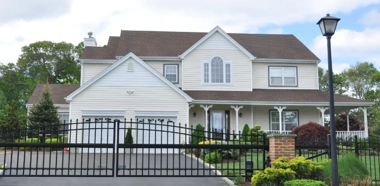 beautiful house with fence in front